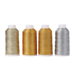 Metallic gold and silver embroidery thread spools for DIY sewing and jewelry making