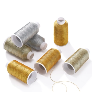 Assorted metallic gold and silver polyester thread spools for DIY jewelry making