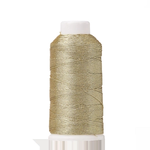 Macro detail of metallic gold polyester embroidery thread wound on a white spool