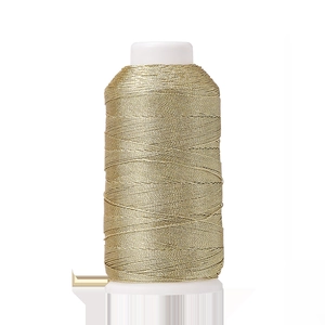 Close-up of metallic gold polyester thread roll for DIY jewelry making and embroidery