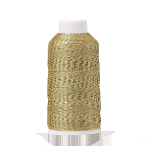 Detail of metallic gold polyester thread wound on white spool for DIY hand knitting