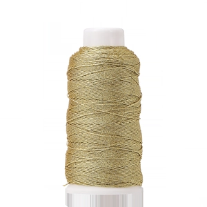 Close-up of golden metallic thread on a white spool for DIY jewelry and embroidery