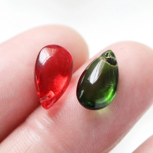 Macro shot of 8x14mm red and green teardrop glass beads for DIY jewelry making