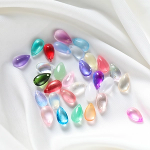 Colorful 8x14mm teardrop glass beads for DIY jewelry making on white silk