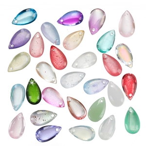 Close-up of 8x14mm colorful teardrop glass beads with glitter and matte finishes for DIY