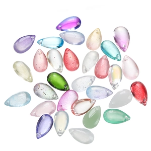 Macro shot of colorful teardrop glass beads with glitter texture for DIY jewelry making