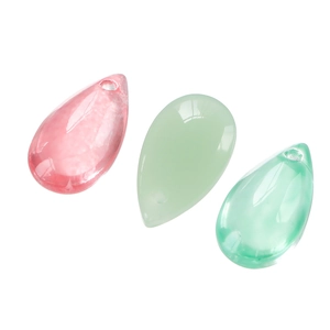 Close-up of 8x14mm teardrop glass beads in pink and green for DIY jewelry making
