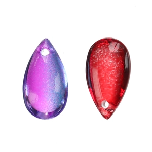 Detail of teardrop glass pendants in purple and red for DIY jewelry and earring making