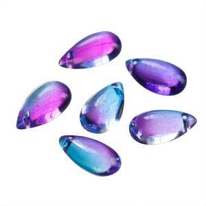 Macro detail of 8x14mm aurora teardrop glass beads with iridescent blue-purple gradient