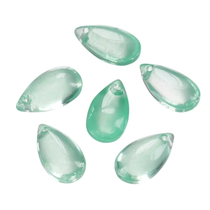 Detailed close-up of light green teardrop glass beads with horizontal holes for DIY jewelry