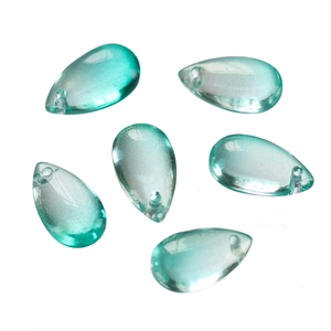 Detailed view of six teardrop-shaped lake green glass beads with transparent finish