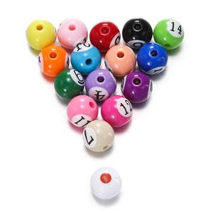 Detailed macro view of colorful numbered acrylic billiard ball beads for DIY jewelry crafts