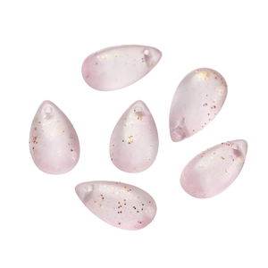 Macro view of six light pink teardrop glass beads with gold glitter for DIY jewelry