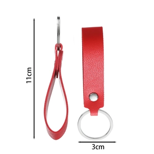 Detail of red faux leather keychain with lychee texture and 11cm length dimension