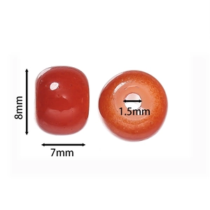 Detail view of 8x7mm orange translucent glass apple beads with 1.5mm hole size