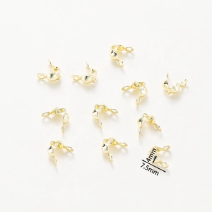Detail view of 7.5mm x 4mm rose gold plated clam shell bead tips for DIY jewelry making