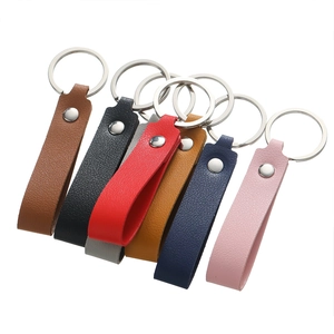 Litchi pattern faux leather keychains in various colors with metallic silver rings