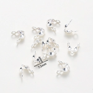 Detail view of 4mm silver bead tips knot covers for DIY jewelry making and connecting