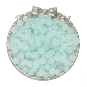 Macro detail of 8x7mm mint green semi-transparent glass beads for DIY jewelry making