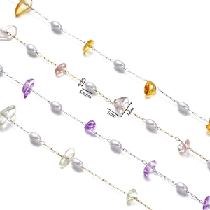 Macro view of multi-color gemstone chips and pearls chain for DIY jewelry making