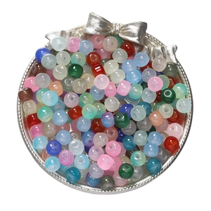Colorful 8x7mm apple-shaped glass beads for DIY necklaces in a silver bow tray