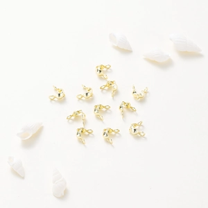 Rose gold plated double-head calottes for jewelry making on white background