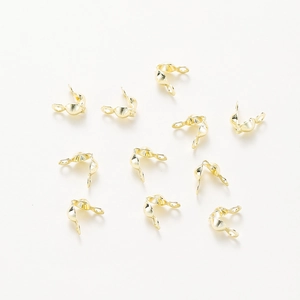 Close-up of 18k rose gold plated double loop crimp covers for DIY jewelry making
