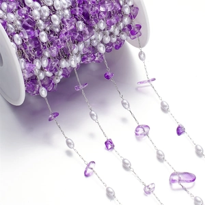 Macro detail of purple amethyst gravel and white pearl beads on stainless steel diy chain
