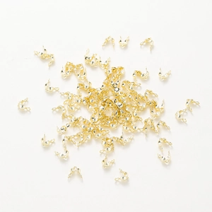 Detail of 18k rose gold plated bead tips for jewelry making and DIY connection