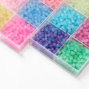 Close-up of colorful 8mm glass apple beads in a transparent organizer box for DIY jewelry