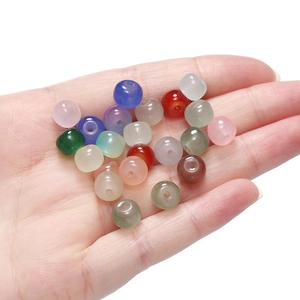 Macro shot of 8x7mm apple-shaped translucent glass beads for DIY jewelry making