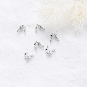 Silver-plated metal jewelry connectors for DIY crafting shown on a white textured background