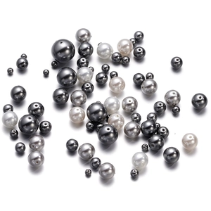Macro shot of 3-12mm polished crystal glass pearls with holes for DIY jewelry making