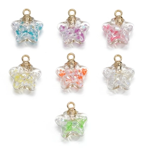 Macro shot of colorful crushed stone fillings inside star-shaped glass charms for DIY jewelry