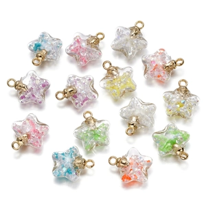 Star-shaped glass pendants filled with colorful crushed stones and glitter details
