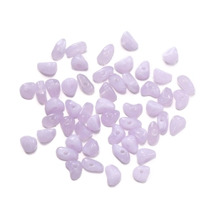 Detailed macro shot of irregular lavender acrylic stone beads for DIY jewelry making