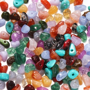 Close-up of colorful irregular acrylic beads with marble textures for DIY jewelry making