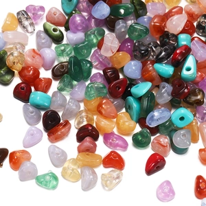 Close-up of irregular acrylic stone beads in 15 colors for DIY jewelry making and crafting
