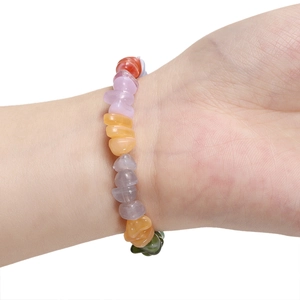 Close-up of colorful irregular acrylic stone beads bracelet worn on a female wrist