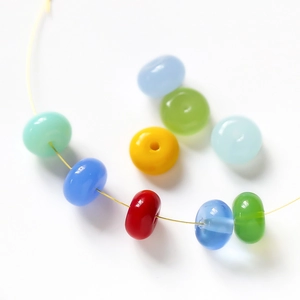 Colorful flat round glass beads for DIY jewelry making in vibrant candy colors
