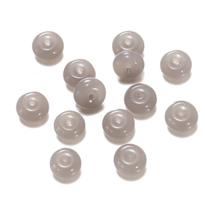 Macro detail of translucent grey glass abacus beads with smooth polished finish for DIY jewelry