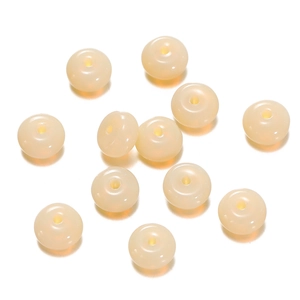 Macro view of beige candy-colored glass abacus beads for DIY jewelry making with 1.5mm hole