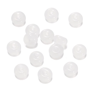 Macro detail of translucent white flat round glass beads for DIY jewelry making and crafts
