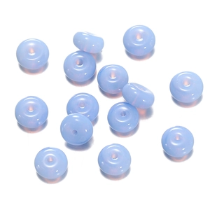 Detailed close-up of light blue translucent glass abacus beads with central holes