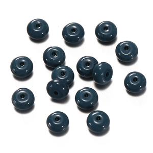 Macro detail of glossy dark blue abacus glass beads for DIY jewelry making and crafts