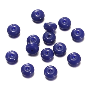 Detailed close-up of deep blue glass rondelle beads for DIY jewelry making