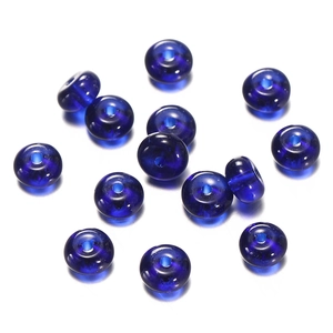 Macro view of dark blue translucent glass abacus beads with a smooth polished finish