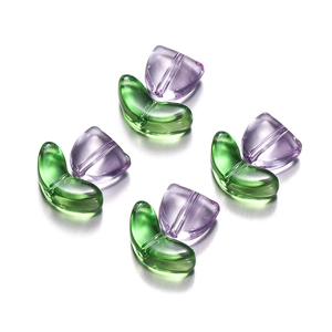 Macro shot of purple tulip flower and green leaf acrylic beads for DIY jewelry making