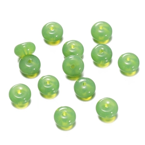 Macro shot of 1.5mm light green translucent candy glass beads for DIY jewelry making