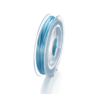 Detailed view of 0.8mm light blue elastic crystal bead string on a clear plastic spool